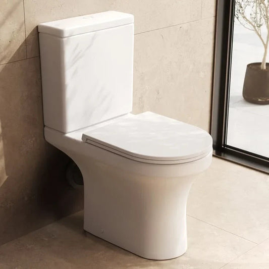 Toilettes avec un abattant WC forme U en blanc 