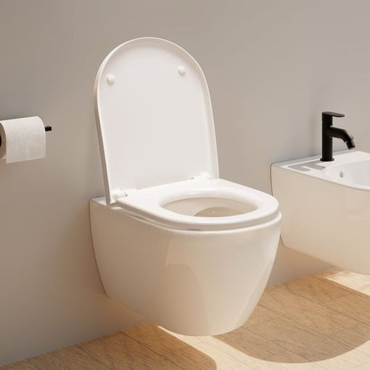 Toilettes avec un abattant WC blanc ouvert 