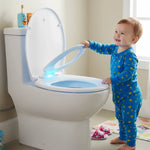 Abattant WC avec réducteur enfant à LED ouvert par un enfant 