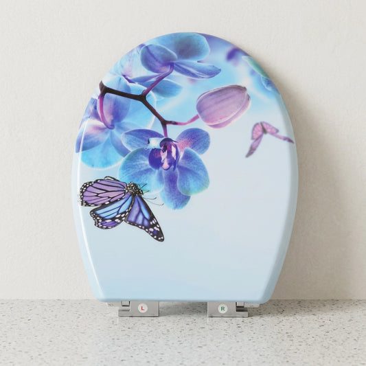 Un abattant WC forme O clipsable avec un motif papillon et fleurs en violet 