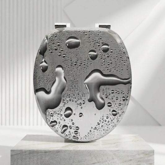 Un abattant WC forme O gris avec motif de goutes d'eaux et des charnières en acier inoxydable 